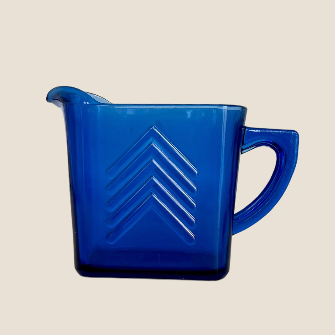 Enhance Your Tabletop with a Vintage Blue Glass Pitcher for Serving Milk Jewelry Bubble