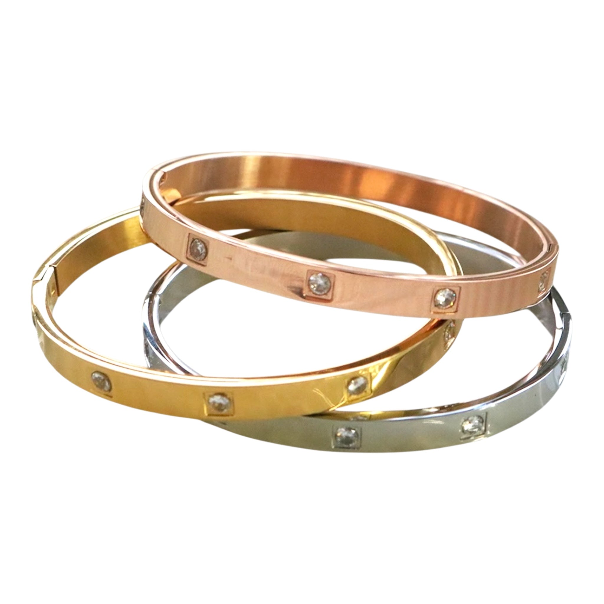 Stack of three elegant fashion bangle bracelets in gold, rose gold, and silver tones with sparkling crystal accents – Jewelry Bubble bracelets collection hero image