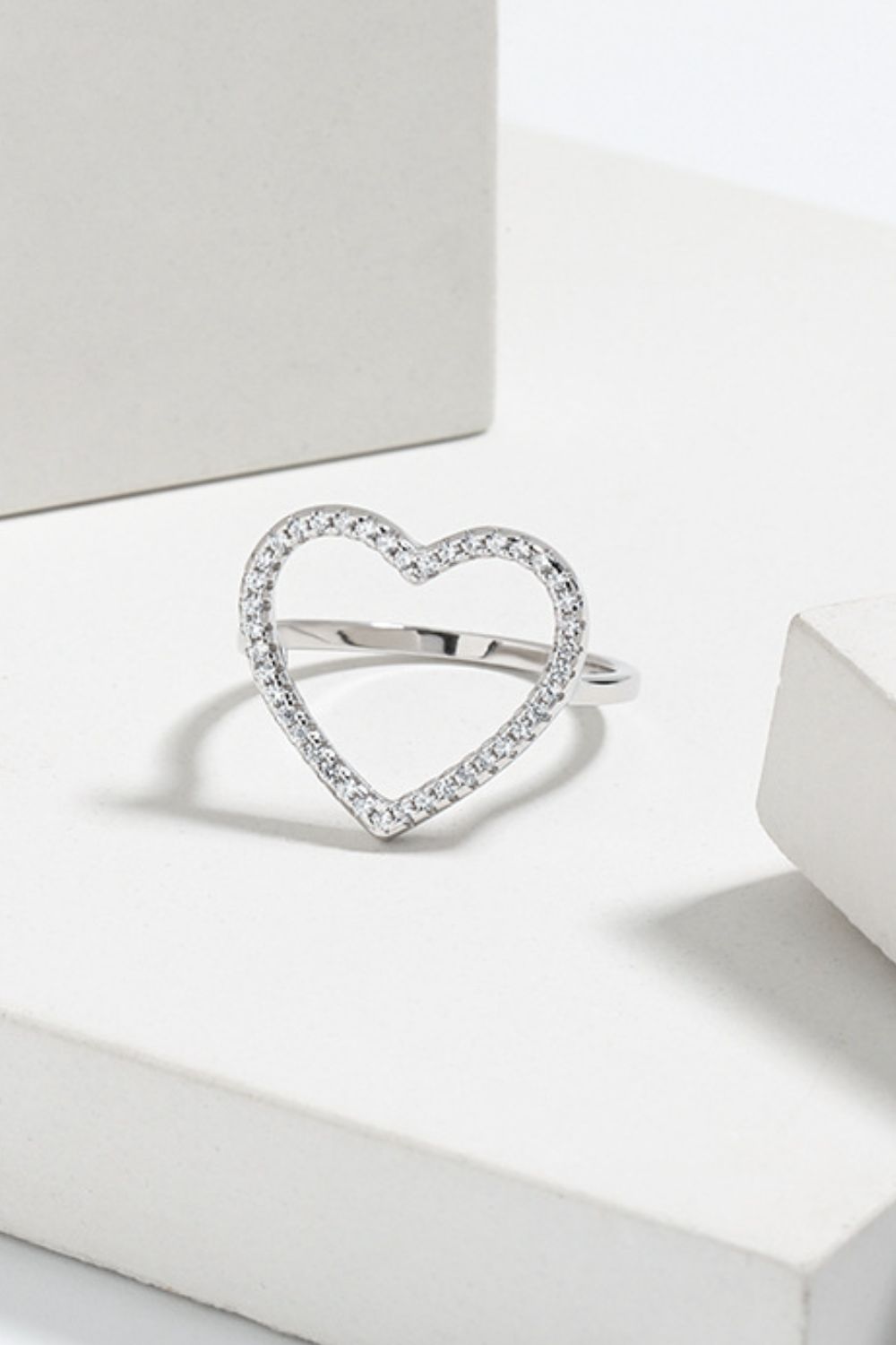 Open Heart Ring: Elegant Zircon-StuddPavé Cubic Zirconia Open Heart Ringed Design in Gold and Silver Finishes Trendsi