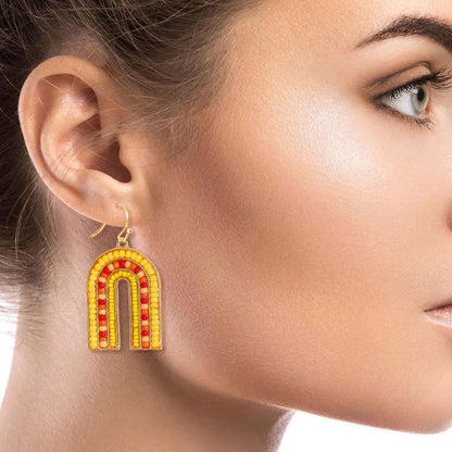 Complete your look with our beautiful Yellow Seed Beaded Arch Earrings Jewelry Bubble