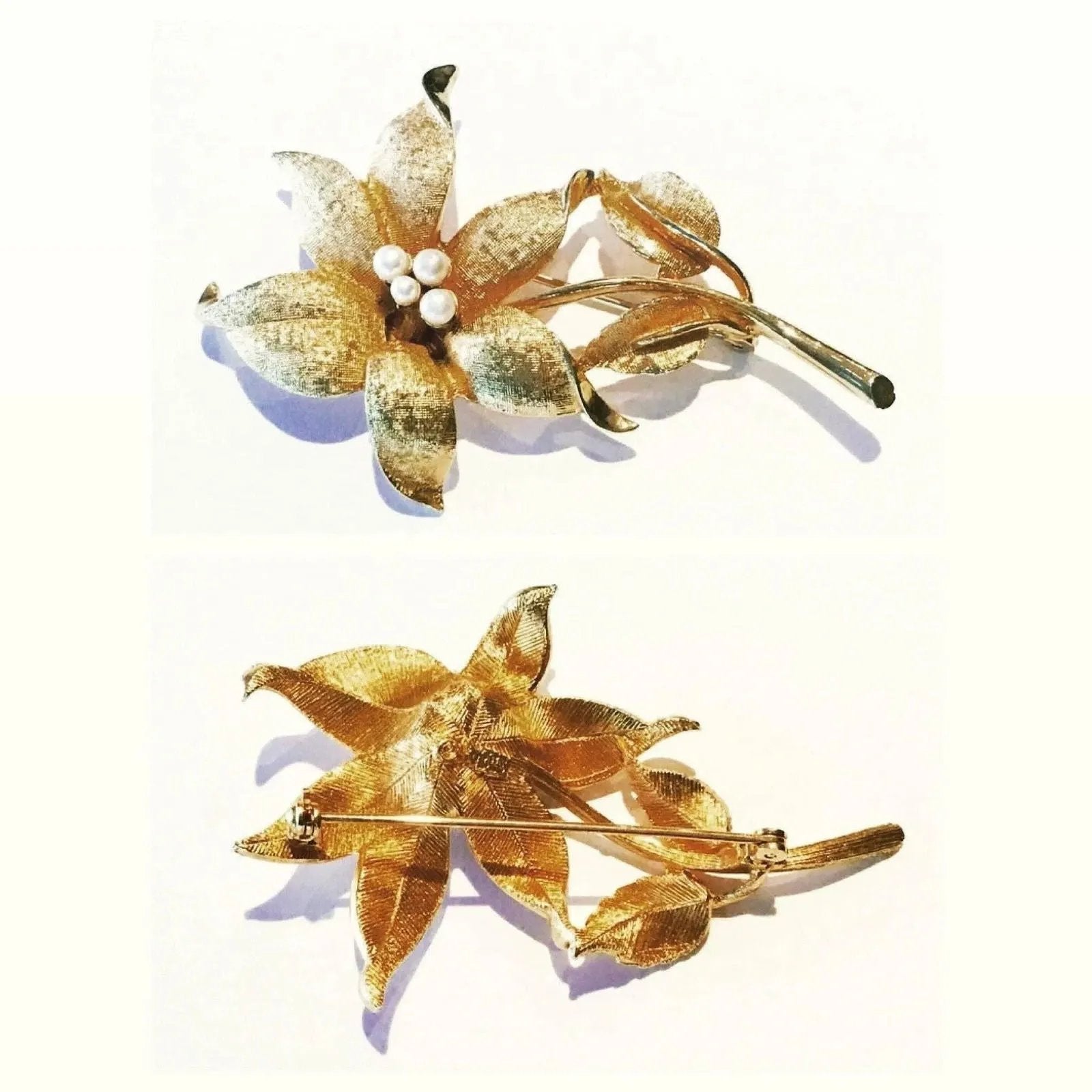 Coro brooch in brushed gold tone metal with simulated pearls