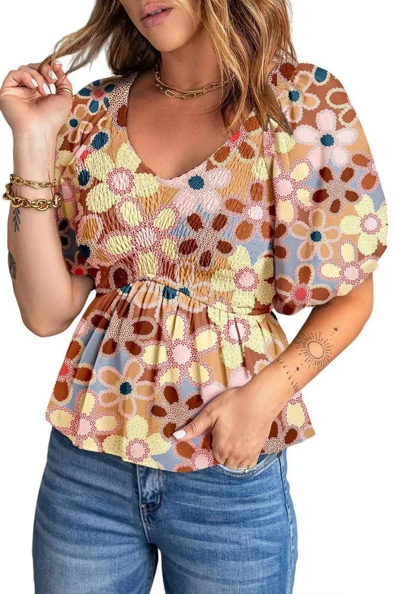 Fall in love with our Flower Print Puff Sleeve Peplum Top - Shop Now!