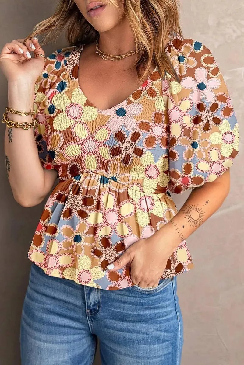 Fall in love with our Flower Print Puff Sleeve Peplum Top - Shop Now!