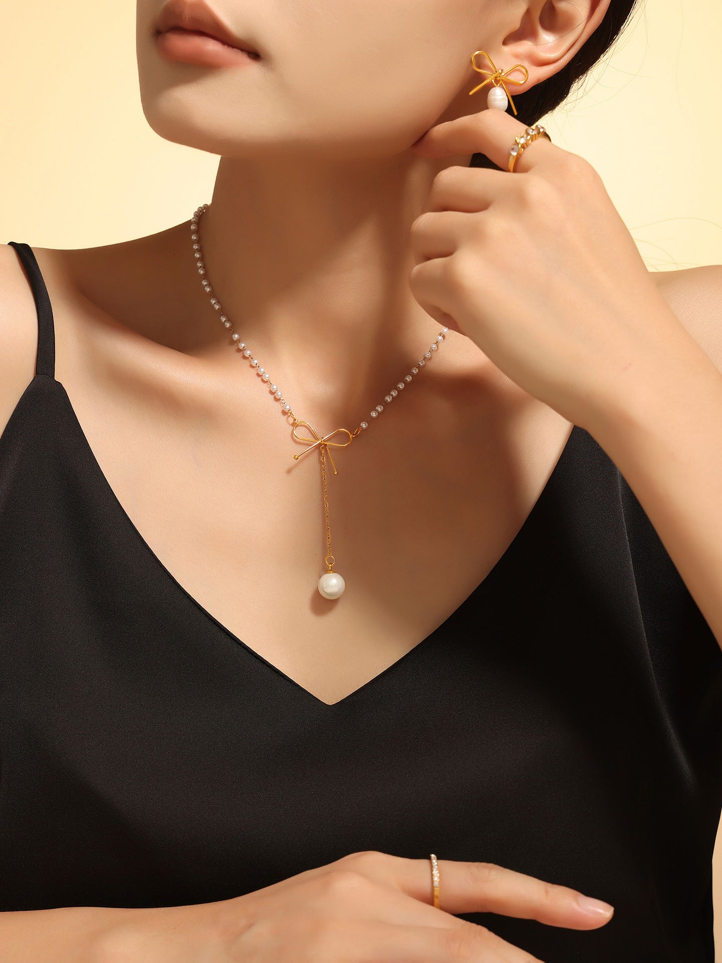 Graceful Bow Necklace with Faux Pearl Accent Jewelry Bubble