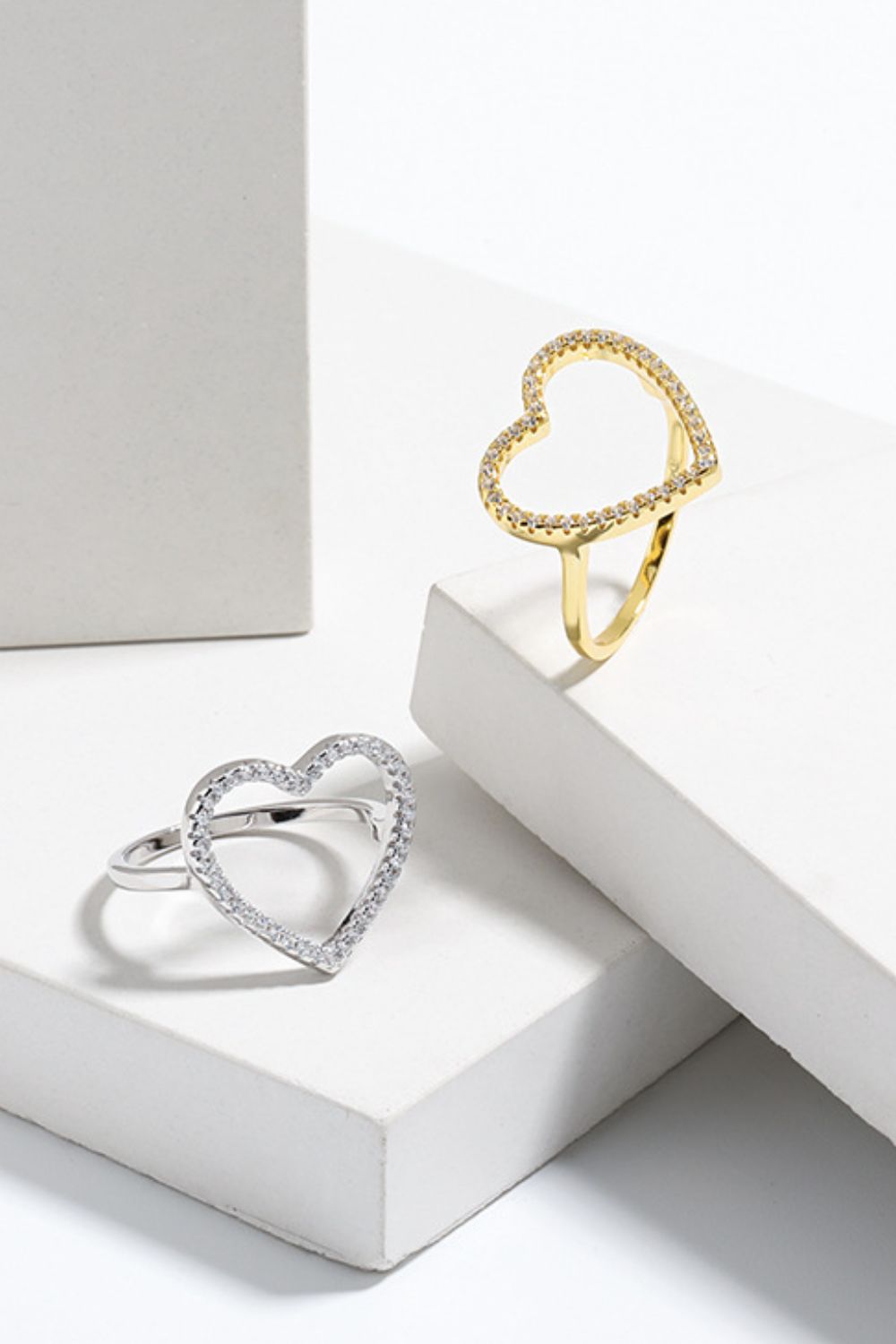 Open Heart Ring: Elegant Zircon-StuddPavé Cubic Zirconia Open Heart Ringed Design in Gold and Silver Finishes Trendsi