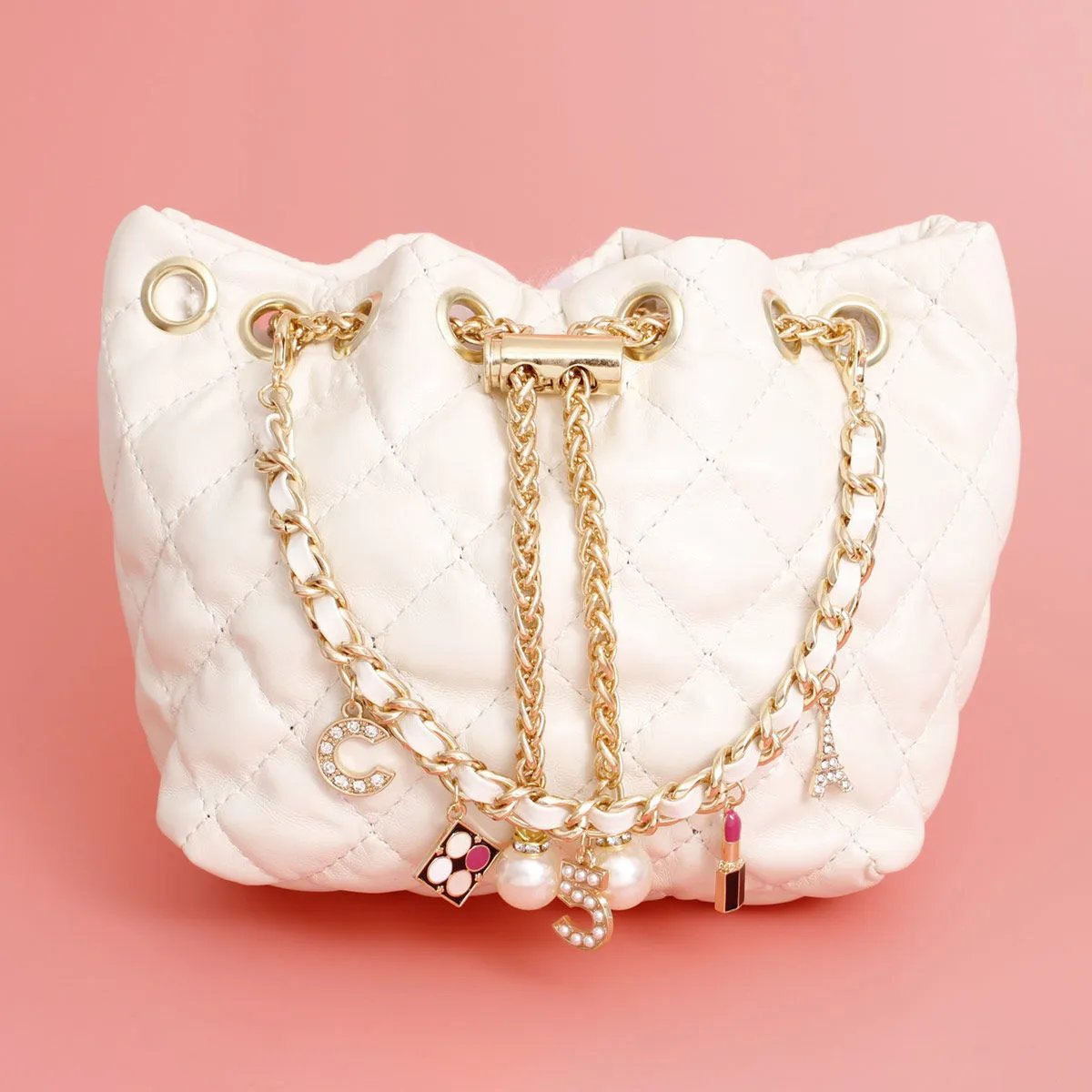 White Quilted Vegan Faux Leather Bag with Parisian-Inspired Charms