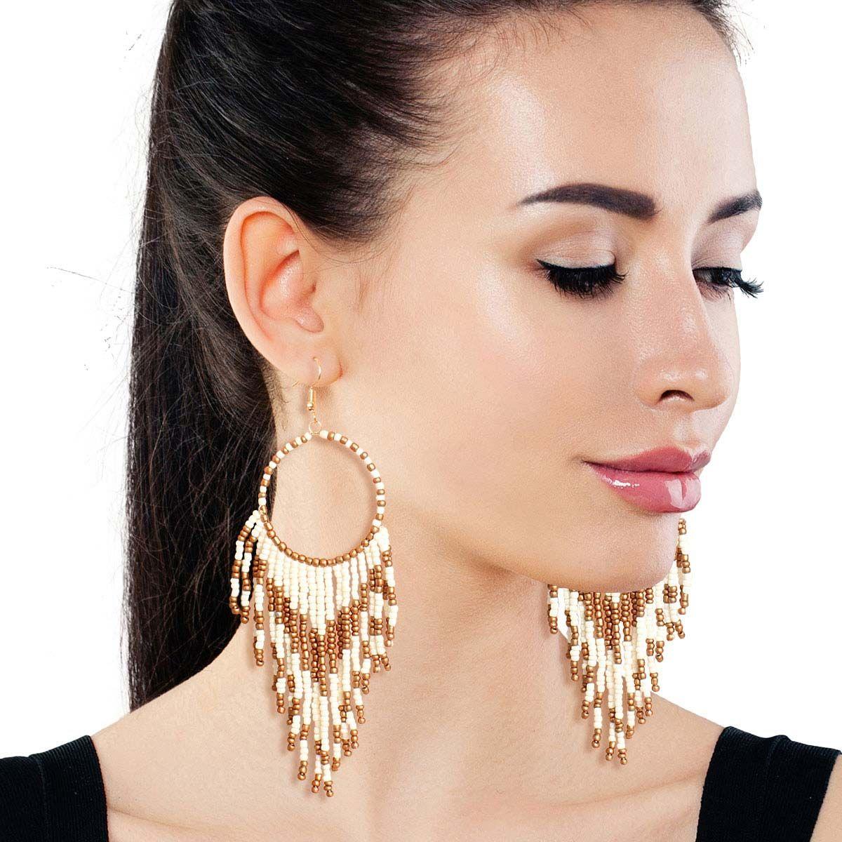 Make a Statement with Stunning Cream & Gold Dangle Earrings