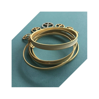 Truly eye-catching vintage stack bangles dangle peace charms