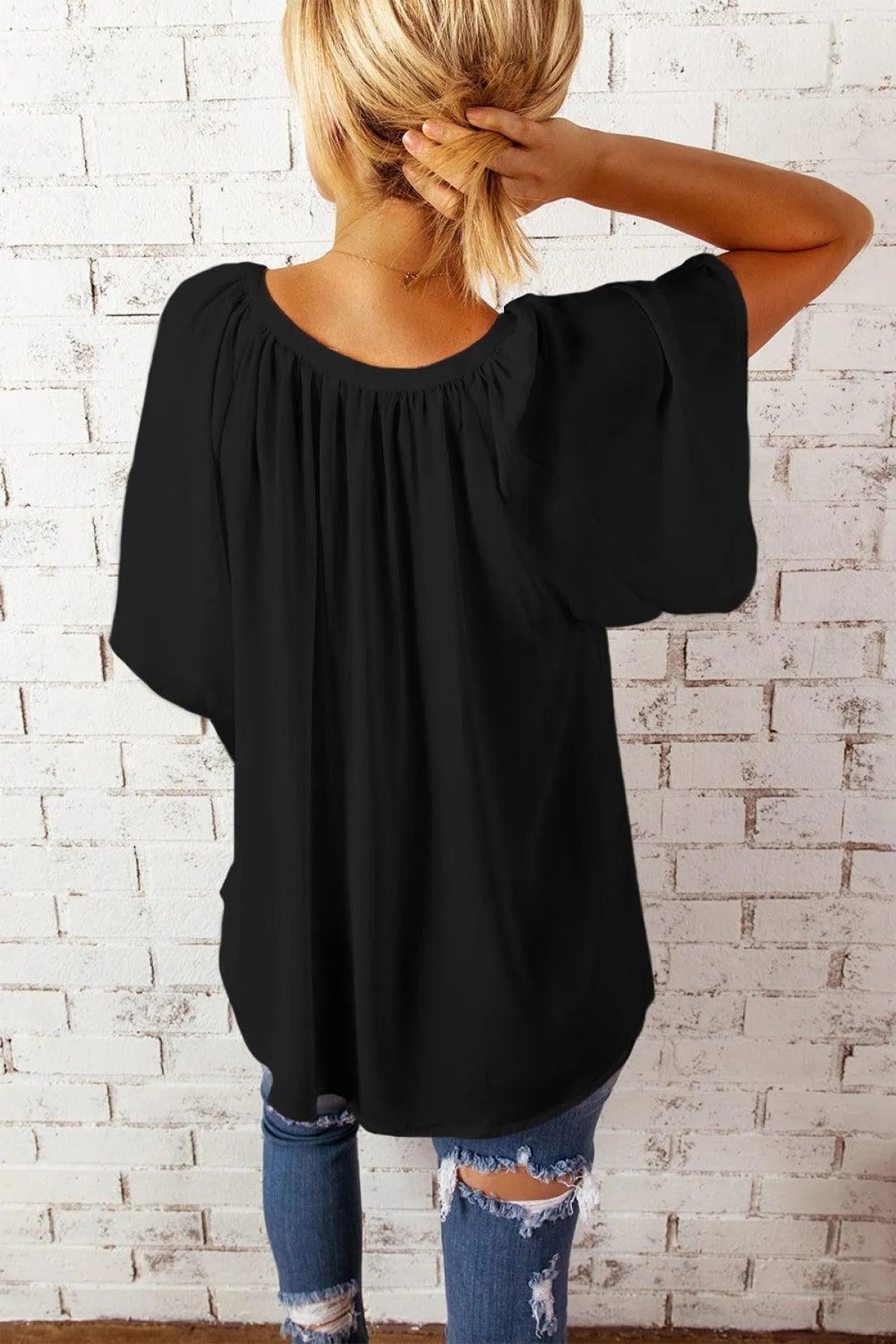 Embrace the Floral Trend with this Black Draped Top Jewelry Bubble