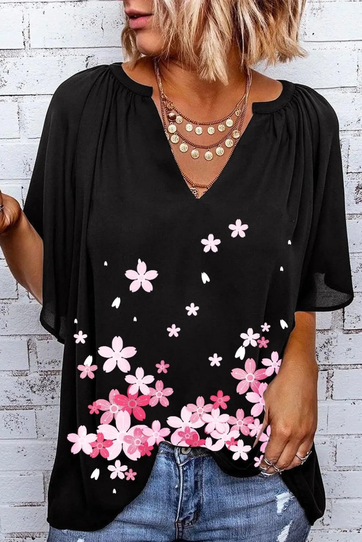 Embrace the Floral Trend with this Black Draped Top Jewelry Bubble