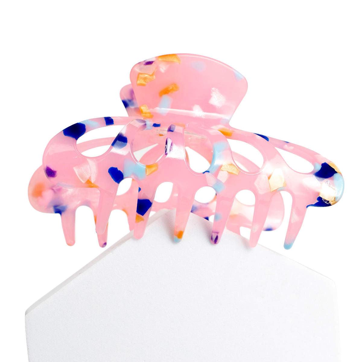 Achieve a Chic Look with the Pink Marble Big Hair Claw Clip