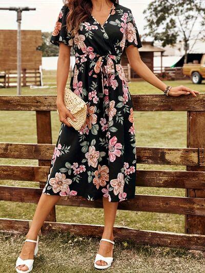 Discover the Charm: Black Surplice Dress with a Floral Print
