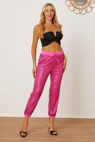 https://jewelrybubble.com/cdn/shop/products/sparkle-up-your-look-with-hot-pink-sequin-drawstring-pants-shop-the-latest-trend-today-jewelry-bubble-7.jpg?v=1707970216